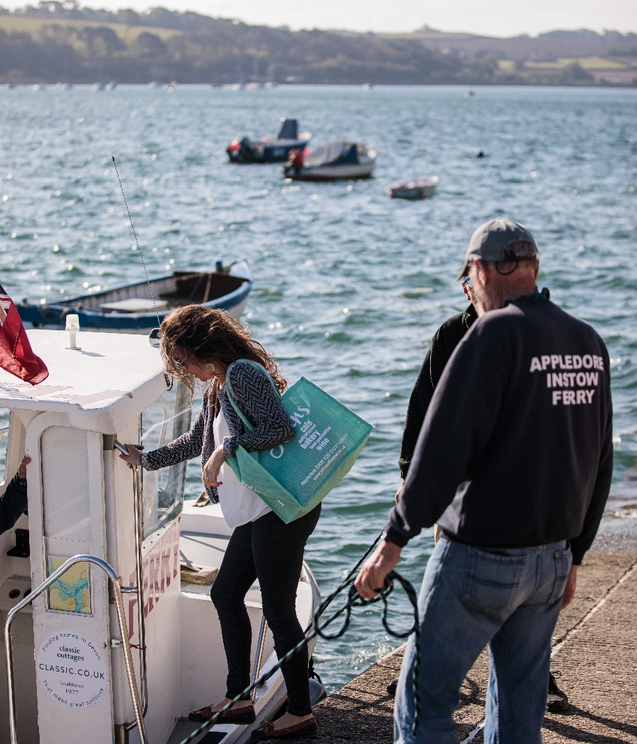 people getting on a boat